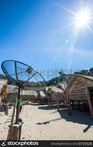 Big telecommunication satellite dish over sunny sky