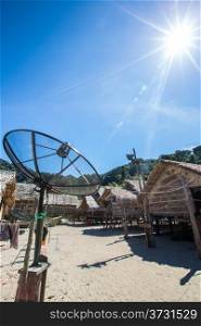 Big telecommunication satellite dish over sunny sky