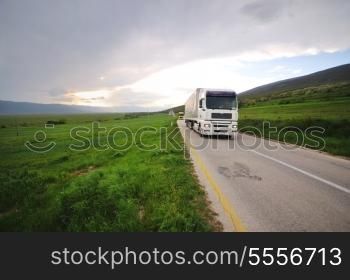 big truck drive on long country road