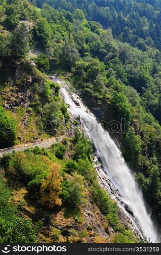 Big Waterfall With Rapids In The Italian Alps