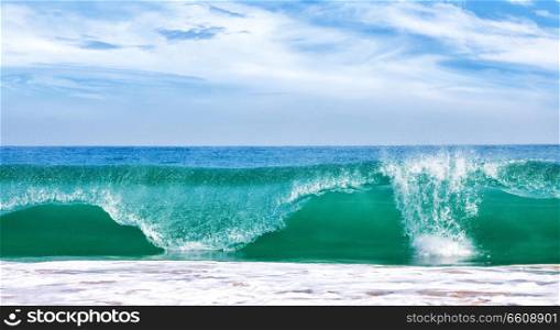 Big wave in ocean with blue sky, panoramic image. Big wave in ocean