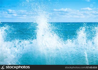 Big wave on the blue sea. Surf and foam