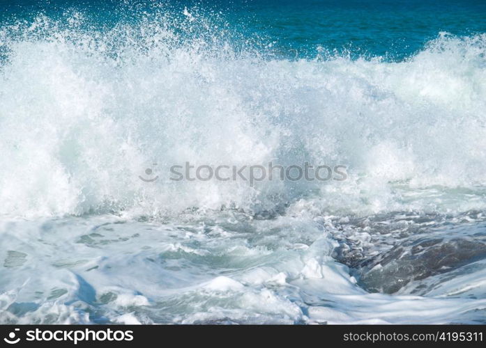 Big wave with sea foam and blue water