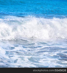 Big wave with sea foam and blue water