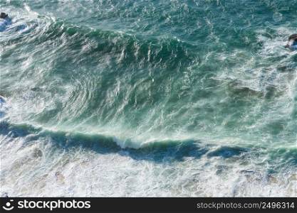 Big waves on ocean beach aerial view