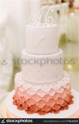 Big wedding cake close-up on the wedding table. Big wedding cake close-up on the wedding table close up