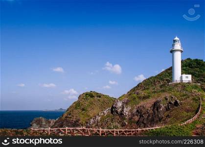 Big white lighthouse on Oganzaki cape. Attraction of Ishigaki island, Okinawa, Japan