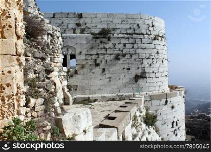 Big white tower of castle Krak de Chevalier in Syria