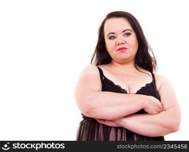Big woman wearing lace lingerie standing with arms folded, on white.. Big woman in underwear with arms folded