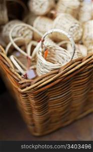 Big woven basket full of small souvenir baskets