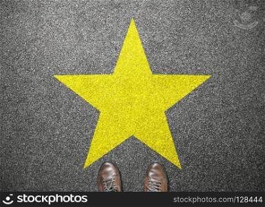 big yellow star on floor with businessman shoes