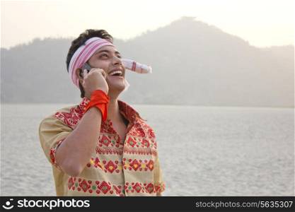 Bihu man talking on a mobile phone