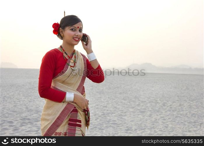 Bihu woman talking on a mobile phone