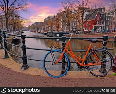 Bike at the canals in Amsterdam Netherlands at sunset