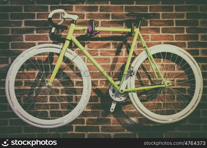 Bike Hanged On Brick Wall