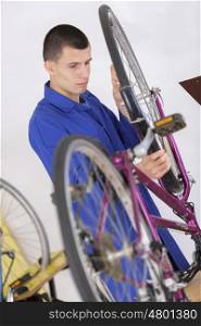 bike service mechanic serviceman repairman a bicycle tyre