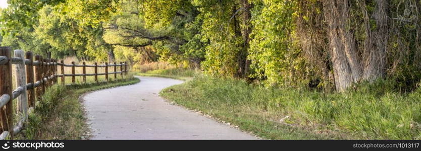 bike trail panorama in early fall - multi use Poudre River Trail in northern Colorado