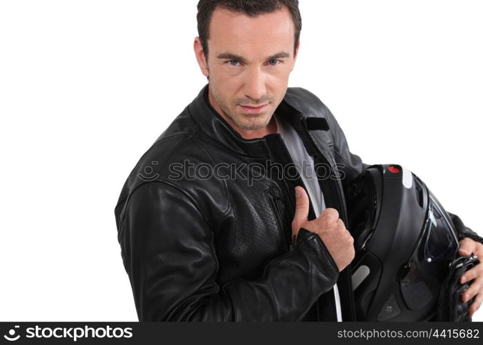 Biker holding helmet