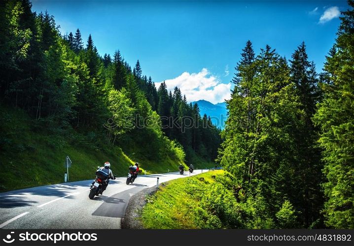 Bikers in mountainous tour, travelling across Europe, curve highway in mountains, scene destinations, extreme transport, active lifestyle