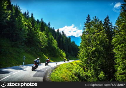 Bikers in mountainous tour, travelling across Europe, curve highway in mountains, scene destinations, extreme transport, active lifestyle