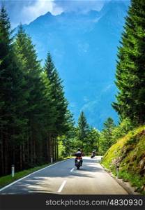 Bikers on the road in Alps, European tour, active lifestyle, driving motorcycle, enjoying freedom, summer holidays, traveling and tourism concept&#xA;