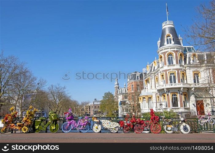 Bikes decorated with flowers in Amsterdam the Netherlands in spring