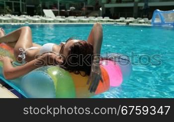 Bikini Female Sunbathing by the Pool