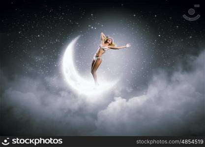 Bikini girl. Hot young dancing woman in white bikini standing on moon