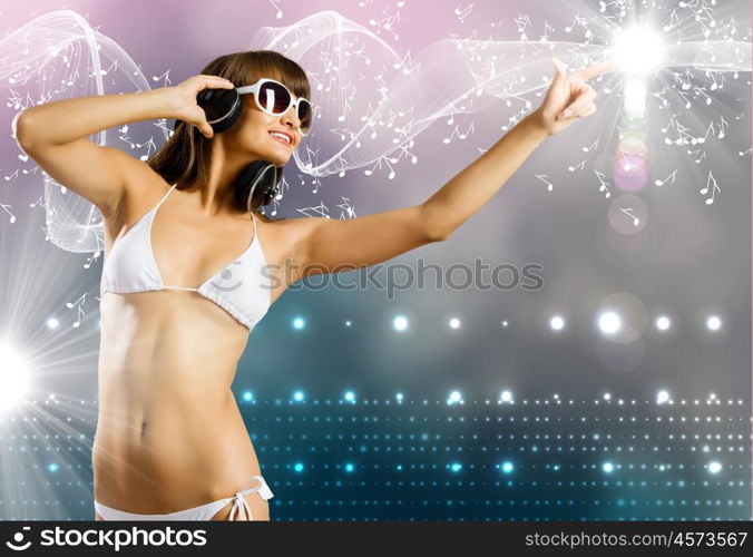 Bikini girl wearing headphones. Young attractive girl in white bikini touching icon