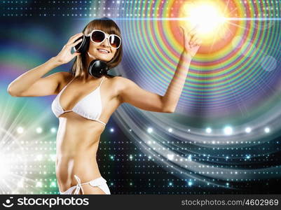 Bikini girl wearing headphones. Young attractive girl in white bikini touching icon