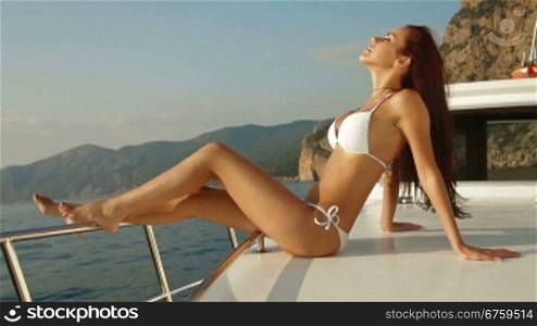 Bikini Woman Posing on Luxury Yacht