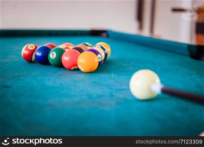 Billard balls and table in a bar.