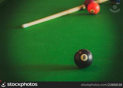 Billiard balls and cue stick on green table. Pool game. Snooker ball and stick on billiard table