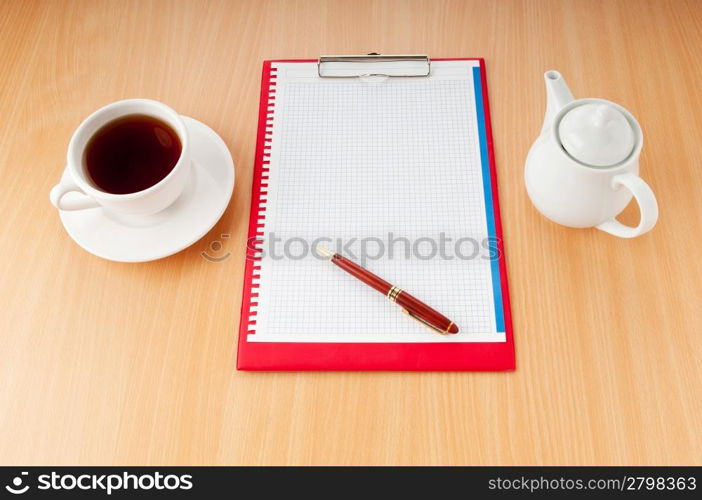 Binder with blank page and tea