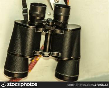 Binocular and rope on the deck of yacht. Tourism and adventure