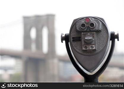 Binoculars on riverbank in Manhattan, New York City, U.S.A.