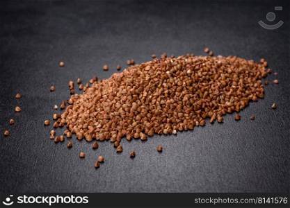 Bio buckwheat cereals raw food background, texture close up. The concept of healthy food, cooking with love. Bio buckwheat cereals raw food background, texture close up