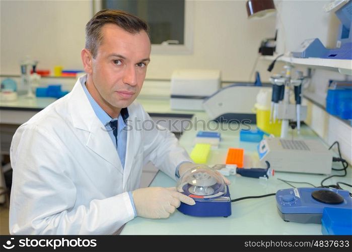 biochemist posing holding an equipment