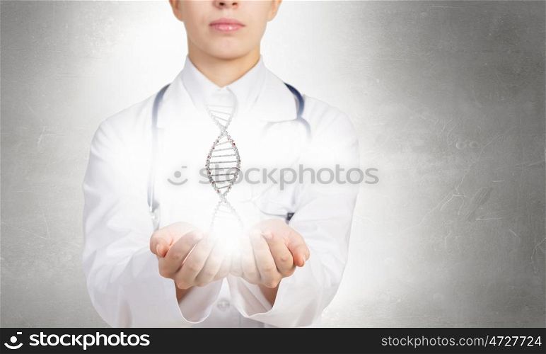 Biochemistry DNA molecule. Woman doctor showing DNA molecule hologram in palms