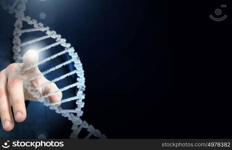 Biochemistry research. Science concept image of human hand touching DNA molecule