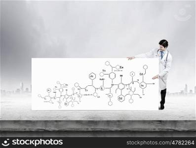 Biochemistry science. Young doctor with white banner presenting molecule research