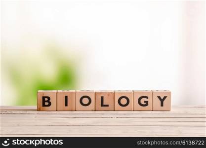 Biology sign made of wood on a table in the nature