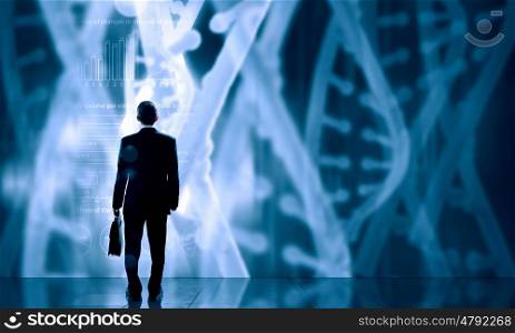 Biotechnologies and DNA research. Businessman standing with back and virtual panel with dna spiral