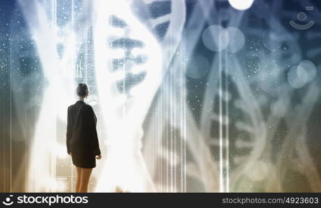 Biotechnologies and DNA research. Businesswoman standing with back and virtual panel with dna spiral