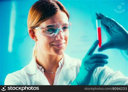 Biotechnology. Female scientist working in laboratory