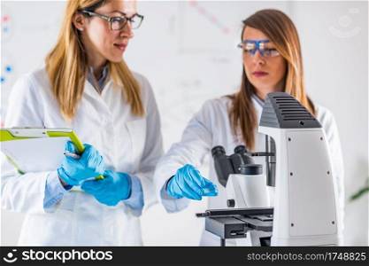  Biotechnology. Female scientists working in laboratory
