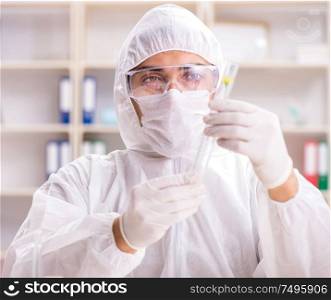 Biotechnology scientist chemist working in lab. The biotechnology scientist chemist working in lab