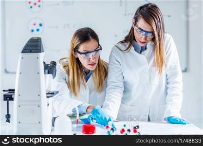 Biotechnology scientists taking notes