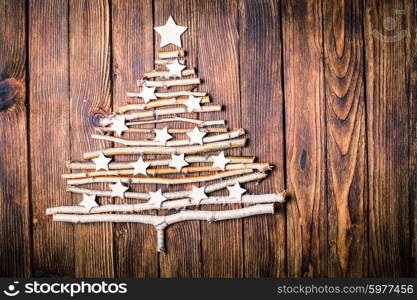 Birch branches and white stars in a shape of christmas tree. Eco Cristmas tree