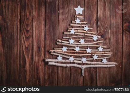 Birch branches and white stars in a shape of christmas tree. Eco Cristmas tree